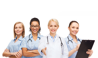 Image showing smiling female doctor and nurses with stethoscope