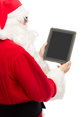 Image showing man in costume of santa claus with tablet pc