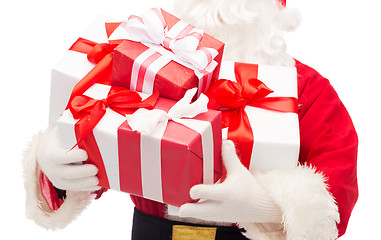 Image showing close up of santa claus with gift boxes