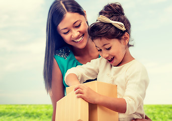 Image showing happy mother and child girl with gift box