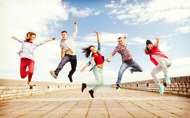 Image showing group of teenagers jumping