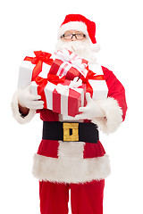 Image showing man in costume of santa claus with gift boxes