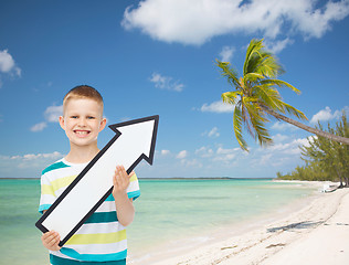 Image showing smiling little boy with blank arrow pointing right