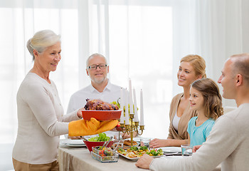 Image showing smiling family having holiday dinner at home