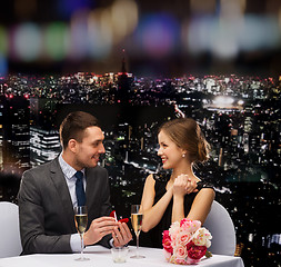 Image showing man proposing to his girlfriend at restaurant