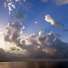 Image showing Sunset and clouds over sea