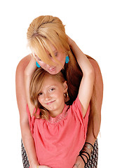 Image showing Daughter hugging mom.