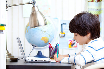 Image showing schoolboy doing homework