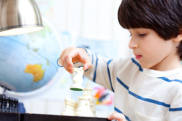 Image showing boy playing a game of chess