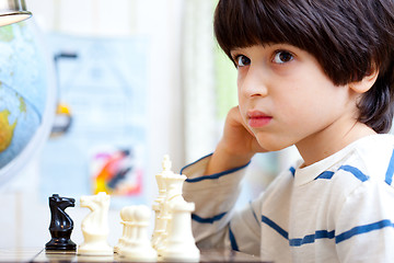 Image showing boy playing a game of chess