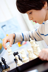 Image showing boy playing a game of chess