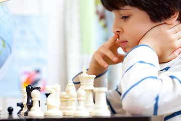 Image showing boy playing a game of chess