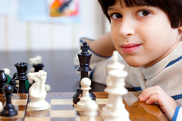 Image showing boy and chess, close-up