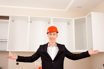 Image showing smiling civil engineer shows new apartment