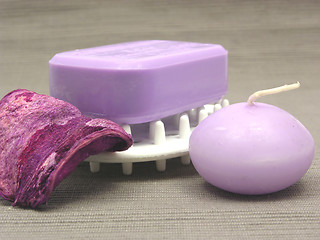 Image showing Lilac soap with candle on a  gray background