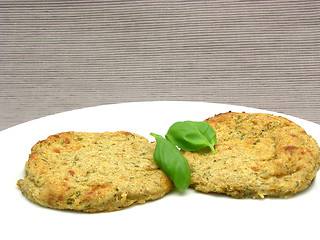 Image showing Round flat potato dough cakes with basil 