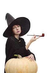 Image showing Witch posing with a pipe