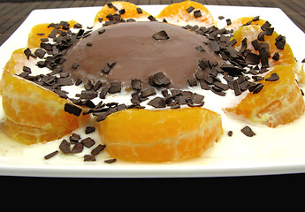 Image showing Chocolate pudding with yoghurt, sliced tangerines and chocolate