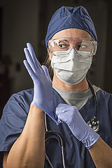 Image showing Concerned Female Doctor or Nurse Putting on Protective Facial We