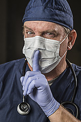 Image showing Secretive Doctor Wearing Protective Head Wear