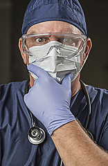 Image showing Determined Looking Doctor or Nurse with Protective Wear and Stet