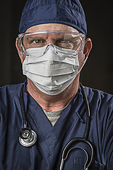 Image showing Determined Looking Doctor or Nurse with Protective Wear and Stet