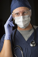 Image showing Concerned Female Doctor or Nurse Wearing Protective Facial Wear