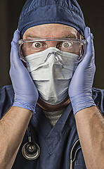 Image showing Stunned Doctor or Nurse with Protective Wear and Stethoscope