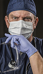 Image showing Determined Looking Doctor or Nurse with Protective Wear and Stet