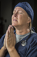 Image showing Pleading in Prayer Female Doctor or Nurse