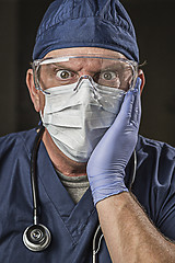 Image showing Stunned Doctor or Nurse with Protective Wear and Stethoscope