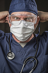 Image showing Determined Looking Doctor or Nurse with Protective Wear and Stet