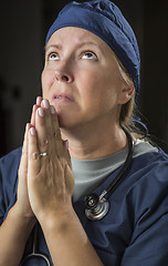 Image showing Pleading in Prayer Female Doctor or Nurse