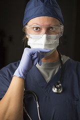 Image showing Concerned Female Doctor or Nurse Wearing Protective Facial Wear