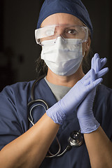 Image showing Concerned Female Doctor or Nurse Wearing Protective Facial Wear