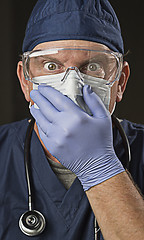 Image showing Stunned Doctor or Nurse with Protective Wear and Stethoscope