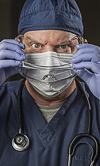 Image showing Determined Looking Doctor or Nurse with Protective Wear and Stet