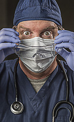 Image showing Determined Looking Doctor or Nurse with Protective Wear and Stet