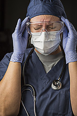 Image showing Grimacing Female Doctor or Nurse Wearing Protective Wear