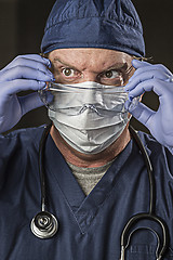 Image showing Determined Looking Doctor or Nurse with Protective Wear and Stet