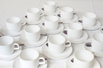 Image showing Group of white coffee cups in cafe bar