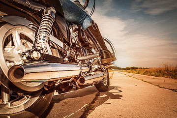 Image showing Biker girl riding on a motorcycle