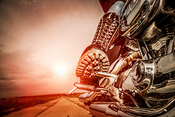 Image showing Biker girl riding on a motorcycle