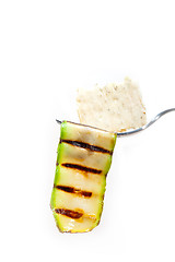 Image showing grilled zucchini courgette with cracker on a fork