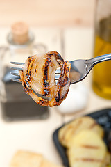 Image showing grilled onion on a fork