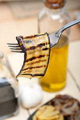 Image showing grilled eggplant oubergine on a fork