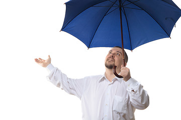 Image showing Man under blue umbrella