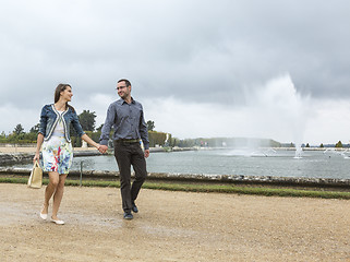 Image showing Happy Young Couple Walking in a French Garden