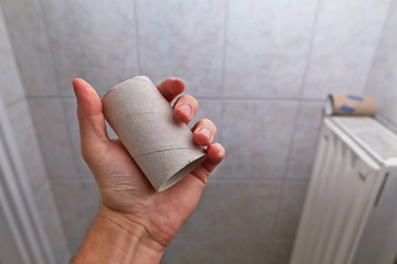 Image showing Finding empty roll in the restroom