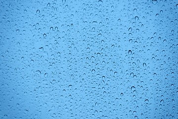 Image showing Natural water drops on glass